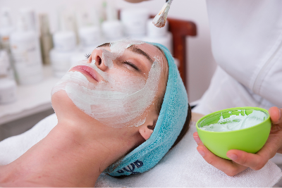 A woman receiving a beauty facial care.