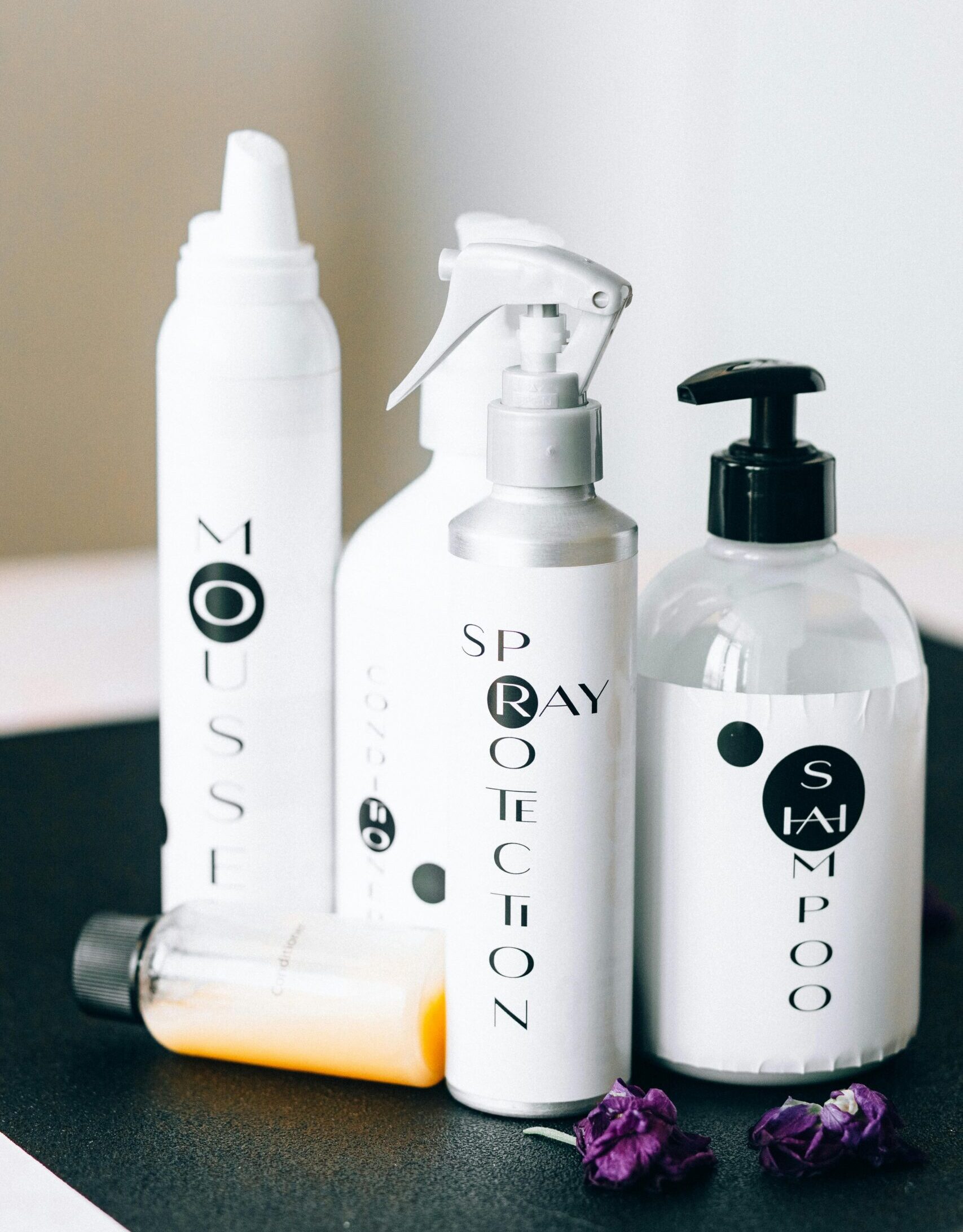 White Cosmetic Plastic Bottles on the Table